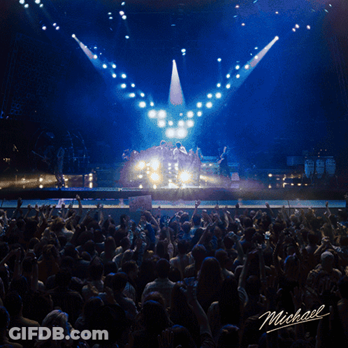 Man Singing Into Microphone On Stage Named Michael GIF