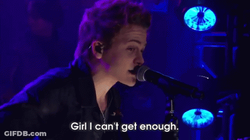 Man Singing Into Microphone On Stage GIF