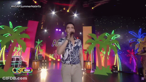 Man Singing Into Microphone On Stage With Palm Trees ASAP Summer GIF