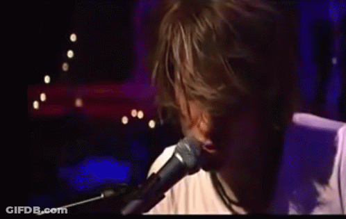 Man Singing Into Microphone GIF