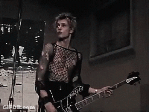 Man Singing Into Microphone Playing Guitar GIF