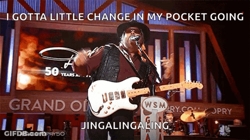 Man Singing Into Microphone Playing Guitar Gotta Little Change In My Pocket GIF