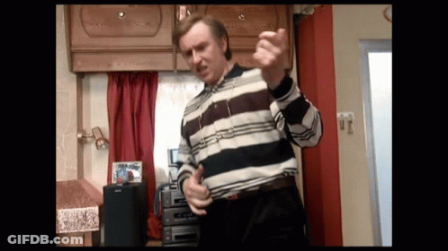 Man Singing Into Microphone Playing Guitar GIF