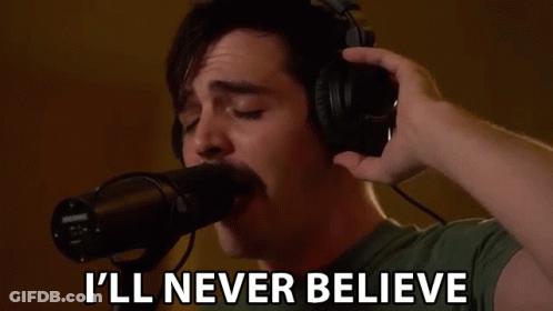 Man Singing Into Microphone Saying I'll Never Believe GIF
