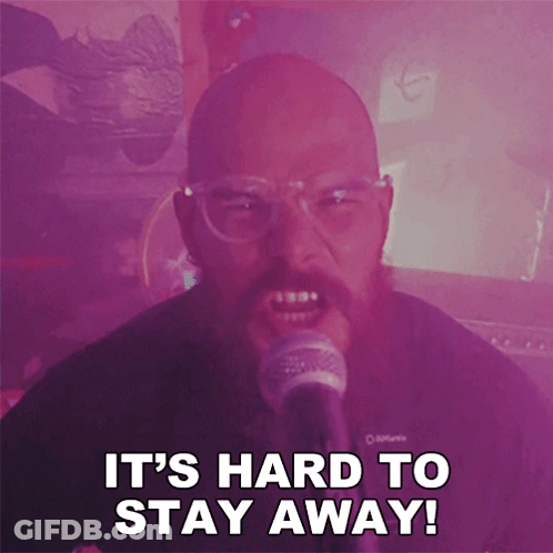Man Singing Into Microphone Saying It's Hard To Stay Away GIF
