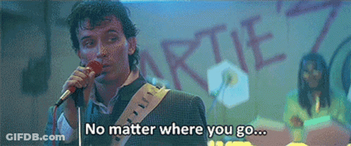 Man Singing Into Microphone Saying No Matter Where You Go GIF