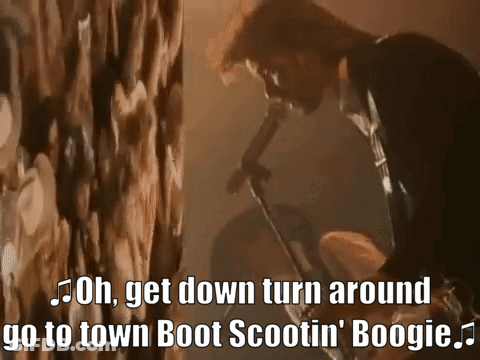 Man Singing Into Microphone Saying Oh Get Down Turn Around Go To Town Boot Scootin Boogie GIF