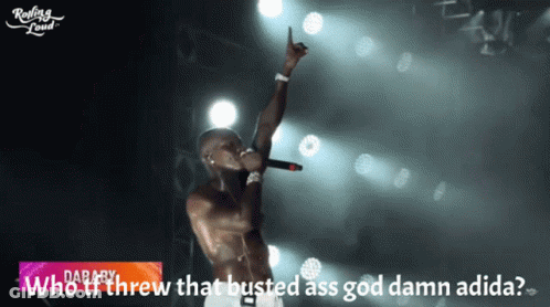 Man Singing Into Microphone Saying Who Threw That Busted Ass God Damn Adidas GIF