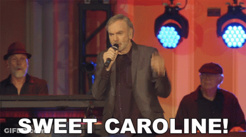 Man Singing Into Microphone Sweet Caroline GIF