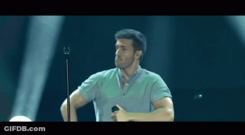 Man Singing Into Microphone Thumbs Up GIF