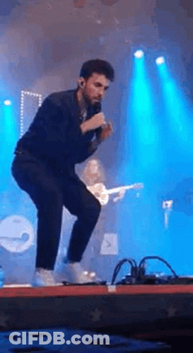 Man Singing Into Microphone GIF