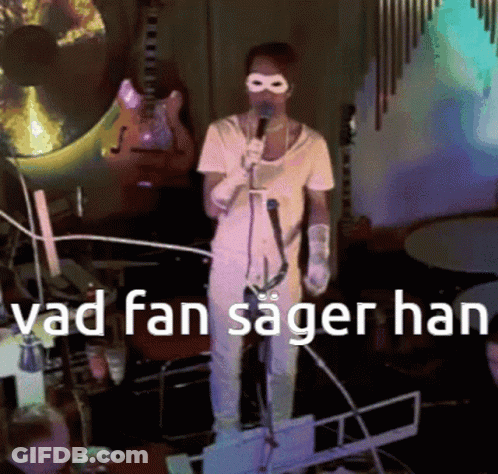 Man Singing Into Microphone Vad Fan Sager Han GIF