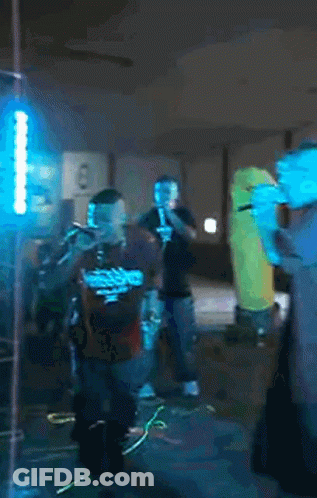 Man Singing Into Microphone Wearing Headphones GIF