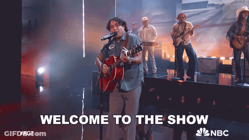 Man Singing Into Microphone Welcome To The Show GIF