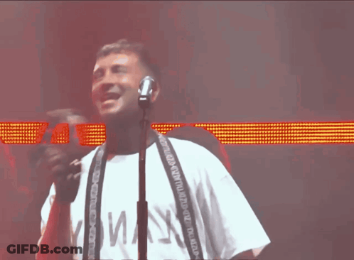 Man Singing Into Microphone White Shirt Maj3 GIF