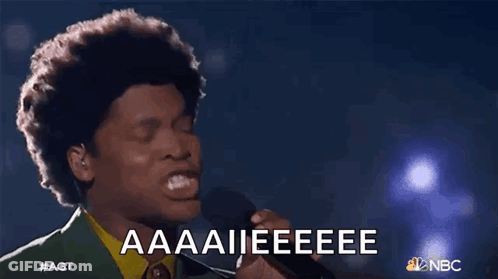 Man Singing Into Microphone With Aaaii Eeeee GIF