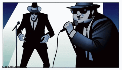 Man Singing Into Microphone With Another Man Behind Him GIF