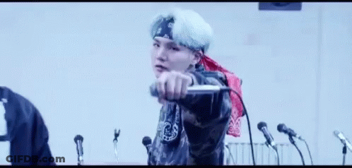 Man Singing Into Microphone With Bandana GIF
