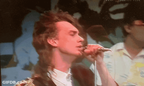 Man Singing Into Microphone With Bird Shadow GIF