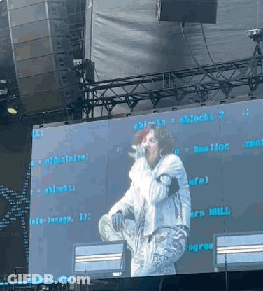 Man Singing Into Microphone With Blocks Screen GIF