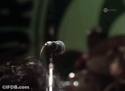 Man Singing Into Microphone With Eyes Closed GIF
