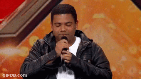 Man Singing Into Microphone With Eyes Closed GIF