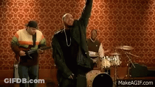 Man Singing Into Microphone With Guitar And Drums GIF