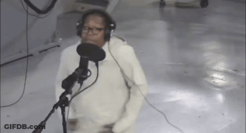 Man Singing Into Microphone With Headphones GIF