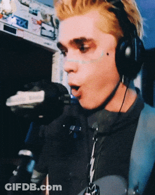 Man Singing Into Microphone With Headphones GIF