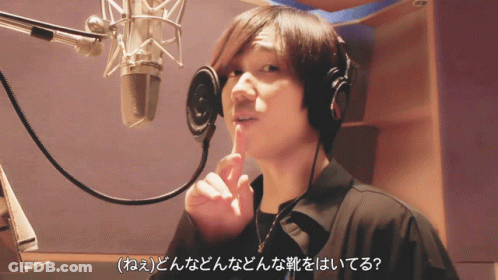 Man Singing Into Microphone With Headphones GIF