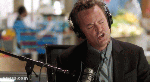 Man Singing Into Microphone With Headphones GIF