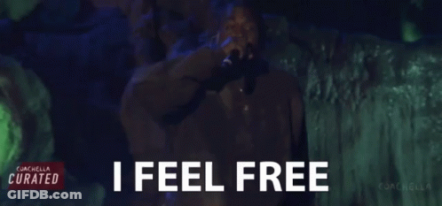 Man Singing Into Microphone With I Feel Free GIF