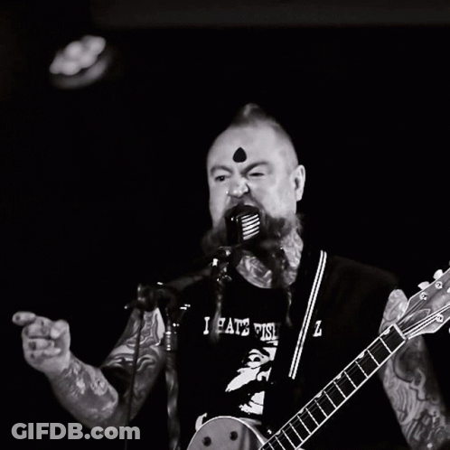 Man Singing Into Microphone With I Hate This Z Shirt GIF