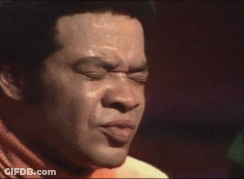 Man Singing Into Microphone With I Know On Chest GIF
