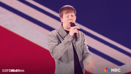 Man Singing Into Microphone With NBC Logo GIF