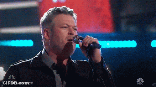 Man Singing Into Microphone With NBC Logo GIF