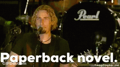 Man Singing Into Microphone With Pearl On Shirt GIF