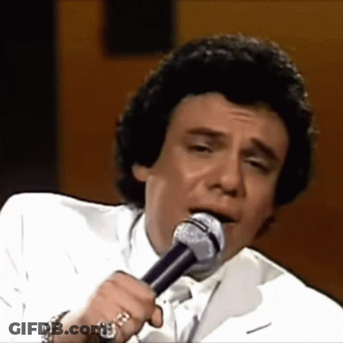 Man Singing Into Microphone With Watch GIF