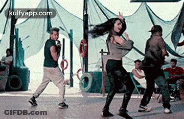Man Singing Into Microphone Woman Dancing GIF