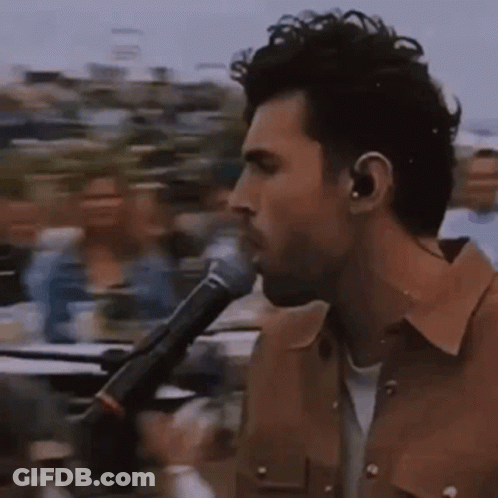 Man Singing Into Microphone GIF