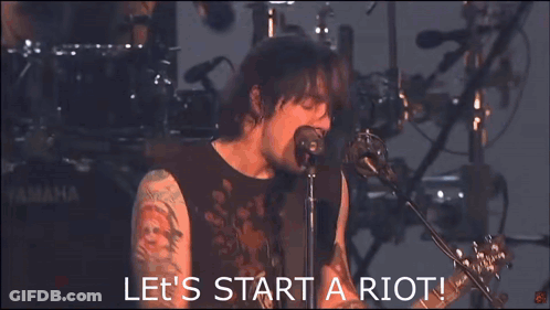 Man Singing Let's Start A Riot GIF