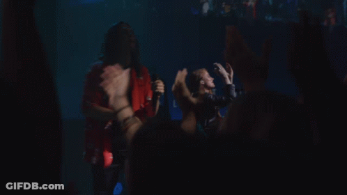 Man Singing On Stage With Band GIF