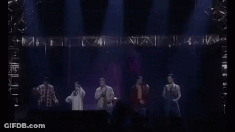 Man Singing Shirtless Into Microphone GIF