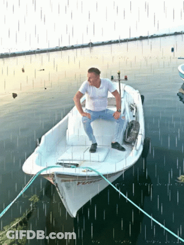 Man Sits On Boat Saying TC GIF