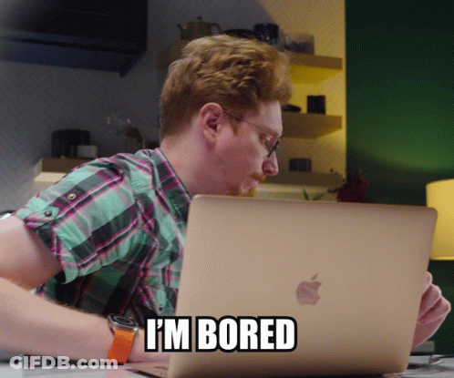 Man Sitting At Apple Laptop Saying I 'M Bored GIF