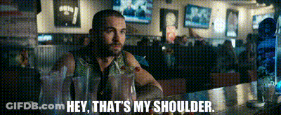 Man Sitting At Bar Saying Hey That's My Shoulder GIF