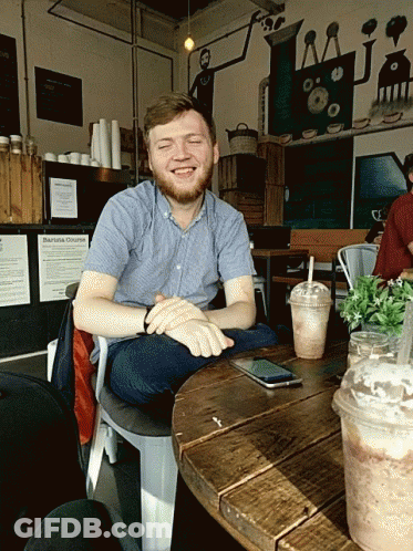 Man Sitting At Barista Chronicles Sign GIF