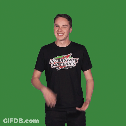 Man Sitting At Checkered Table Talking To Another Man GIF