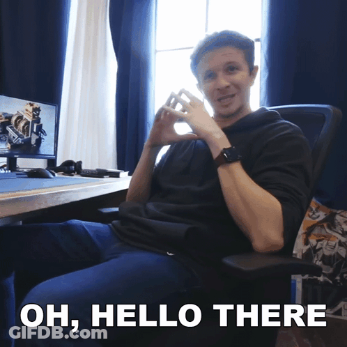 Man Sitting At Computer Saying Oh Hello There GIF