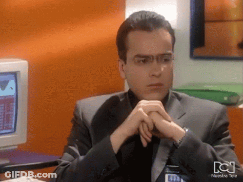 Man Sitting At Computer With Nuestra Tele Shirt GIF